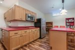 Second kitchen area offers refrigerator, dishwasher, microwave & sink
